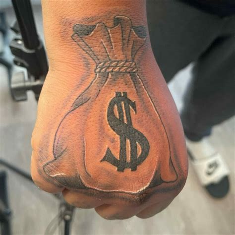 hand money bag tattoo|money over everything tattoo.